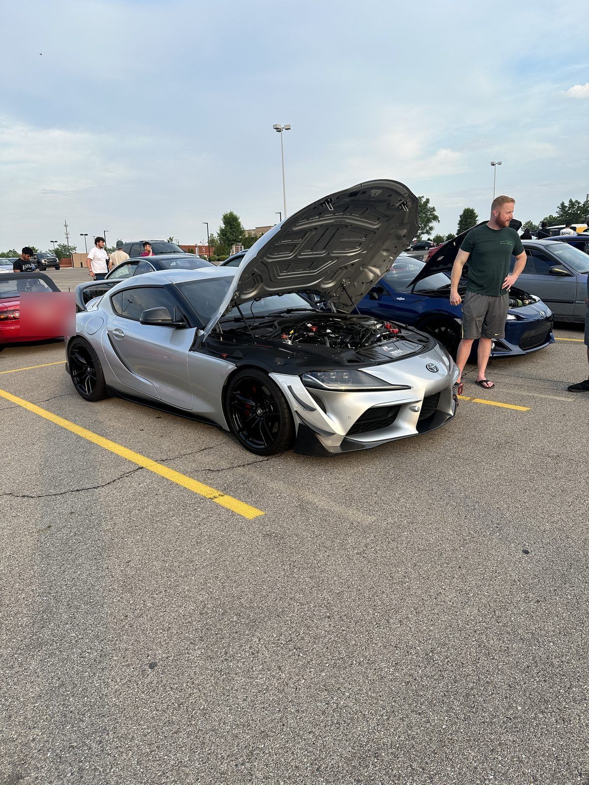 Silver GR Supra with its hood up at a Beavercreek car meet