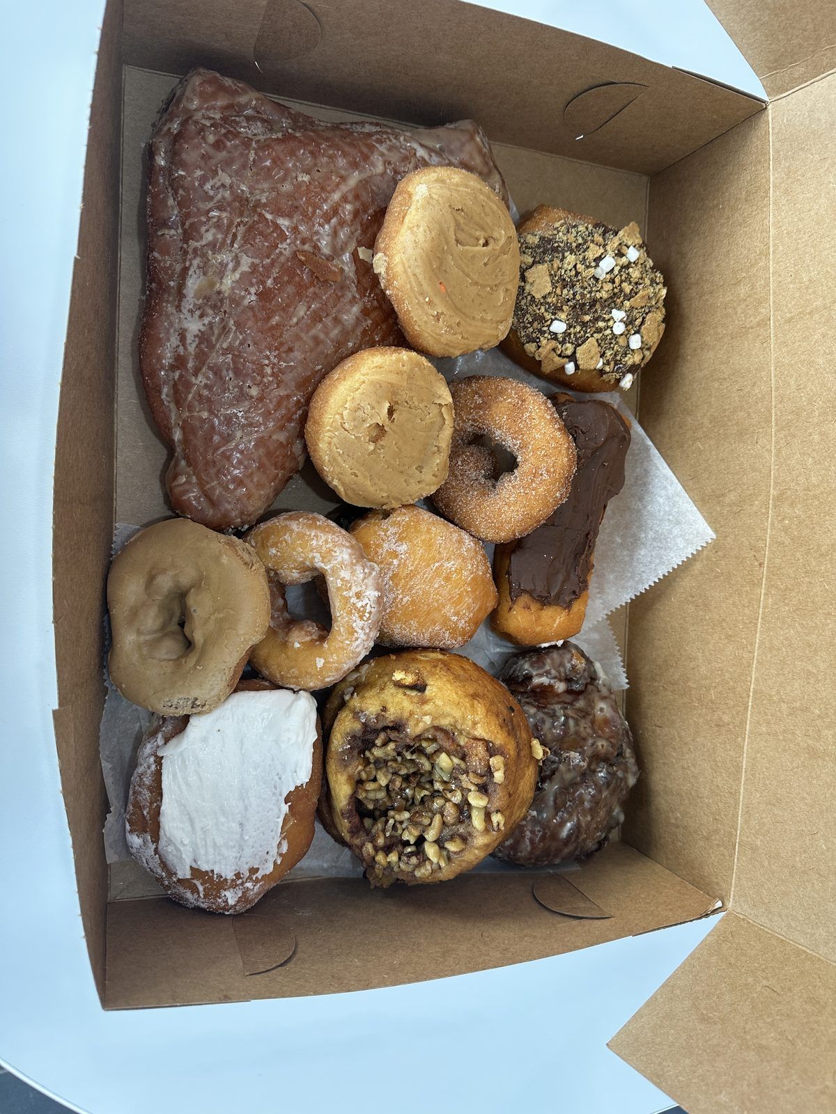 Open box of assorted donuts from Jim’s Donut Shop in Vandalia